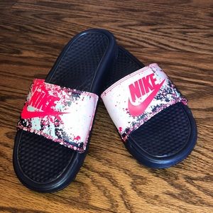 Bright Nike Benassi pink and blue slides